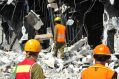 Three professionals on demolition site